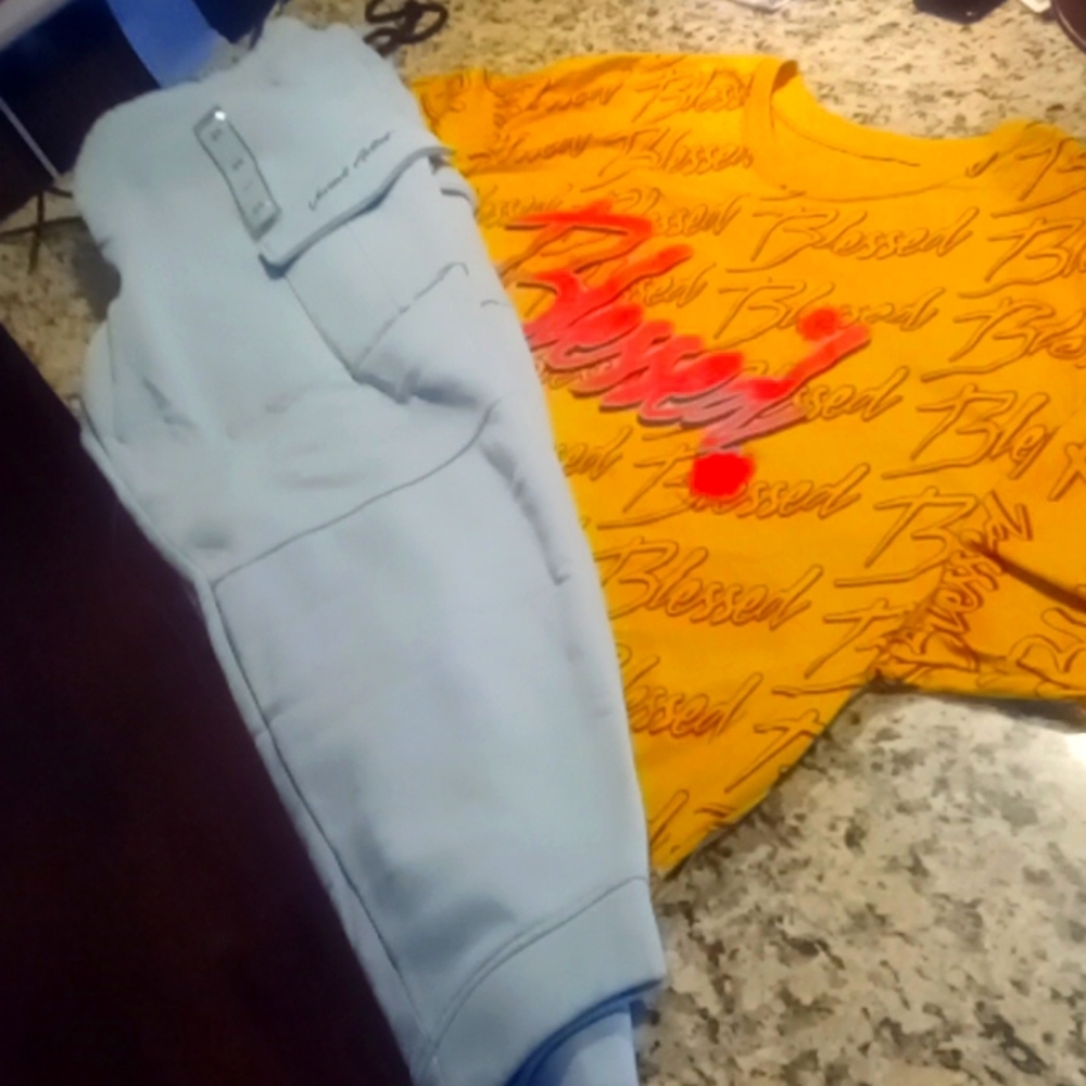 Hustle urban wear blessed tee with the various artist joggers. Brand new